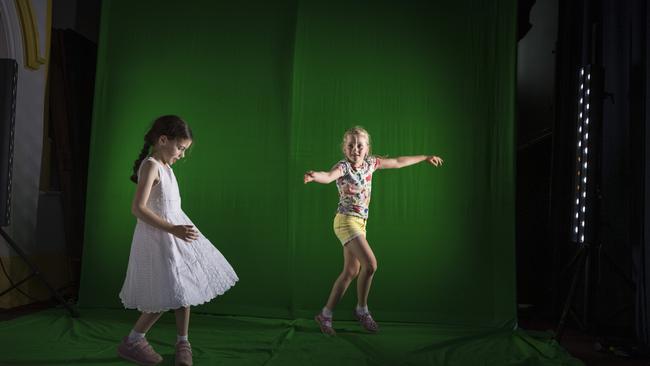 Dancing in front of a green screen are Alexa Cockburn (left) and Sabine Conroy in the Garden of Curiosity. Picture: Kevin Farmer