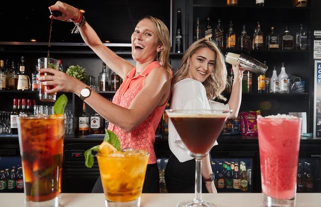 Bartenders Jasmine Hall and Amberlee Withers at the Crown Inn Hotel with their top cocktails. Picture: AAP/Matt Loxton