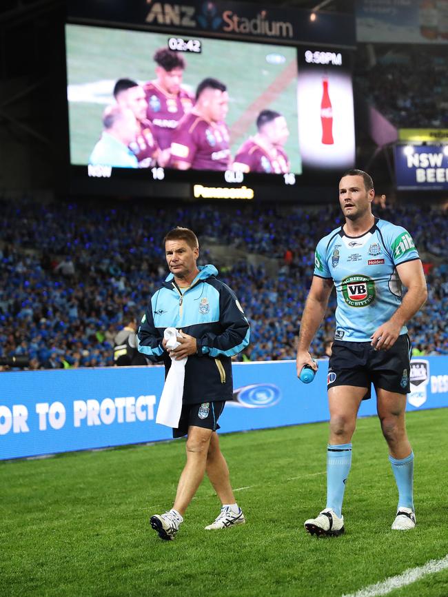 Cordner limps from the field with his calf injury during Game Two. Picture: Brett Costello