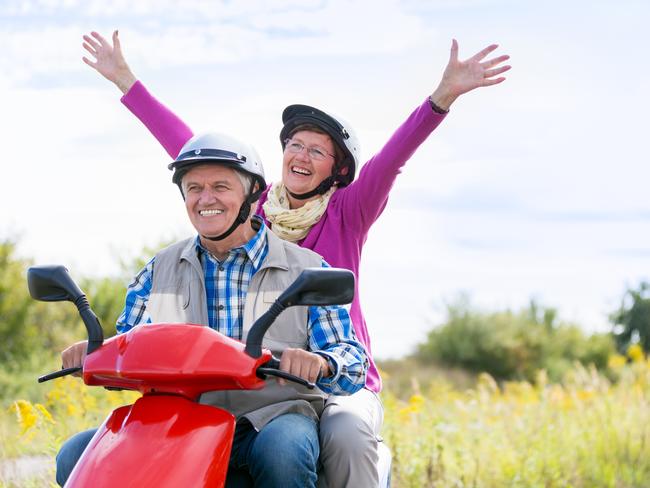 Happy senior couple on motor scooter. For Herald Sun Realestate retirement story 24MAR18. iStock image.