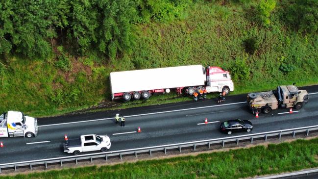 A truck rolled on its side off the Bruce Hwy at Rosemount, near Nambour, on Thursday, March 28. Photo: Steve McElroy