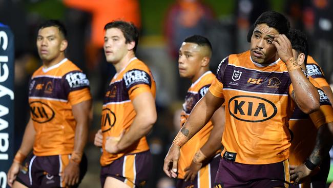 Broncos players digest their loss to the Tigers.