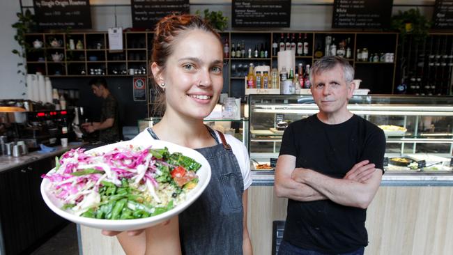 Waitress Olivia Kingston with Cook &amp; Archies cafe co-owner Steve Manakas in Sydney’s inner-city Surry Hills. Picture: Hollie Adams.