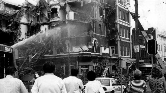 Onlookers watch the demolition of the historic George Hotel in Newcastle.