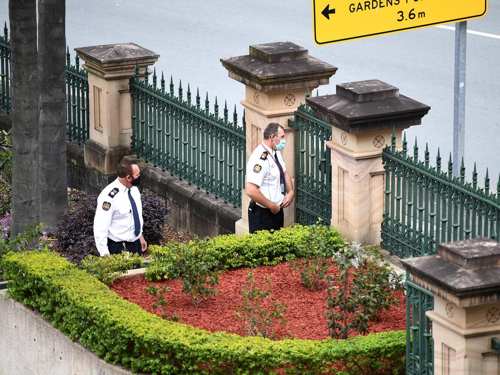 Parliament House guards stand behind a locked gate while it was placed into lockdown due to a threat of an intrusion from a protest outside. Picture: NCA NewsWire / Dan Peled