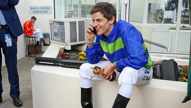 Hall tells someone the good news after winning the Caulfield Cup. Picture: Mark Stewart