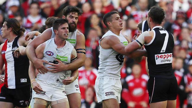 Carlton’s Levi Casboult holds back an angry Marc Murphy as teamte Ed Curnow scuffles with Luke Dunstan. Picture: Michael Klein