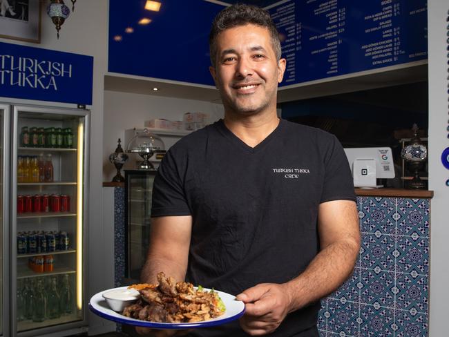 Turkish Tukka co-owner Yusuf Karazor with a mixed plate of marinated rotisserie lamb and chicken, served with bulgur wheat, mixed salad and a garlic and mint yoghurt sauce.Picture: Linda Higginson