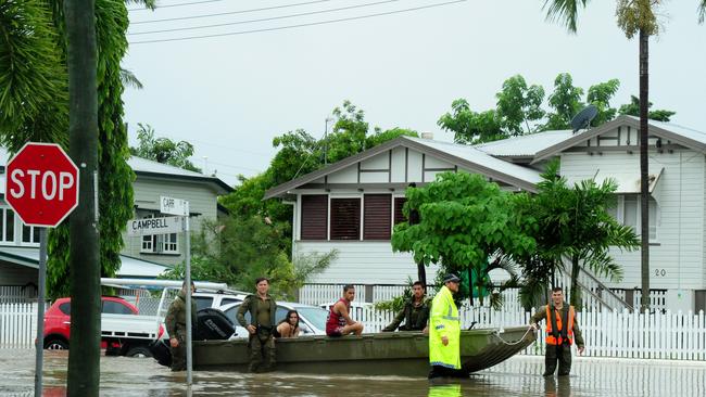 Townsville Floods 2019. An army boat with rescued residents waits for another boat on the intersection of Carr and Campbell Streets, in Hermit Park. Picture: Evan Morgan