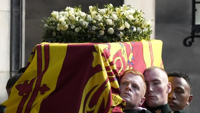 Royal guards carry Queen Elizabeth's coffin into St Giles Cathedral in Edinburgh, Scotland.