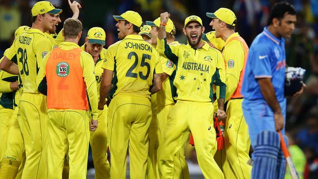 Australia celebrates after DRS showed India's Ajinka Rahane caught behind off Australia's Mitchell Starc during the 2015 ICC Cricket World Cup Semi Final cricket match between Australia and India at the SCG. Pic Brett Costello