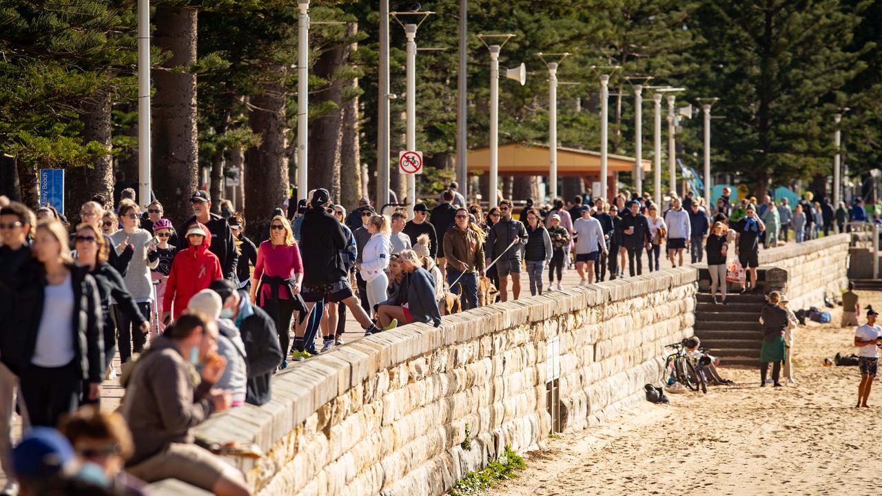 People exercising at Manly Beach in Sydney. Picture: Julian Andrews