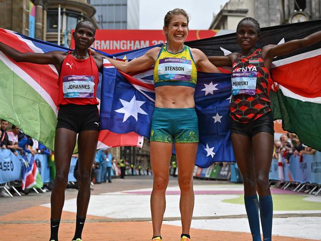 Bronze medallist Namibia's Helalia Johannes (L), Jessica Stenson (C) and silver medallist Kenya's Margaret Wangari Muriuki celebrate their performance. Picture: Ben Stansall / AFP