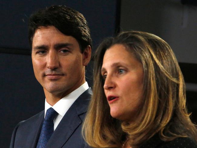 (FILES) Canada's Prime Minister Justin Trudeau (L) and Minister of Foreign Affairs Chrystia Freeland (R) speak at a press conference to announce the new trade pact with Canada, the United States, and Mexico in Ottawa, October 1, 2018. Deputy Prime Minister Chrystia Freeland in a surprise announcement on December 16, 2024, quit over disagreements with Justin Trudeau on Canada's response to US President-elect Donald Trump's tariff threats. (Photo by PATRICK DOYLE / AFP)