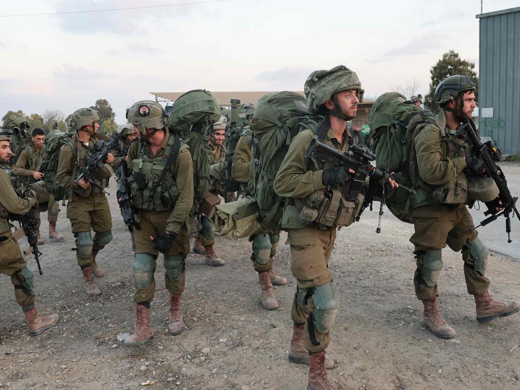 Israeli soldiers deploy at kibbutz Be’eri near the border with Gaza. Picture: AFP