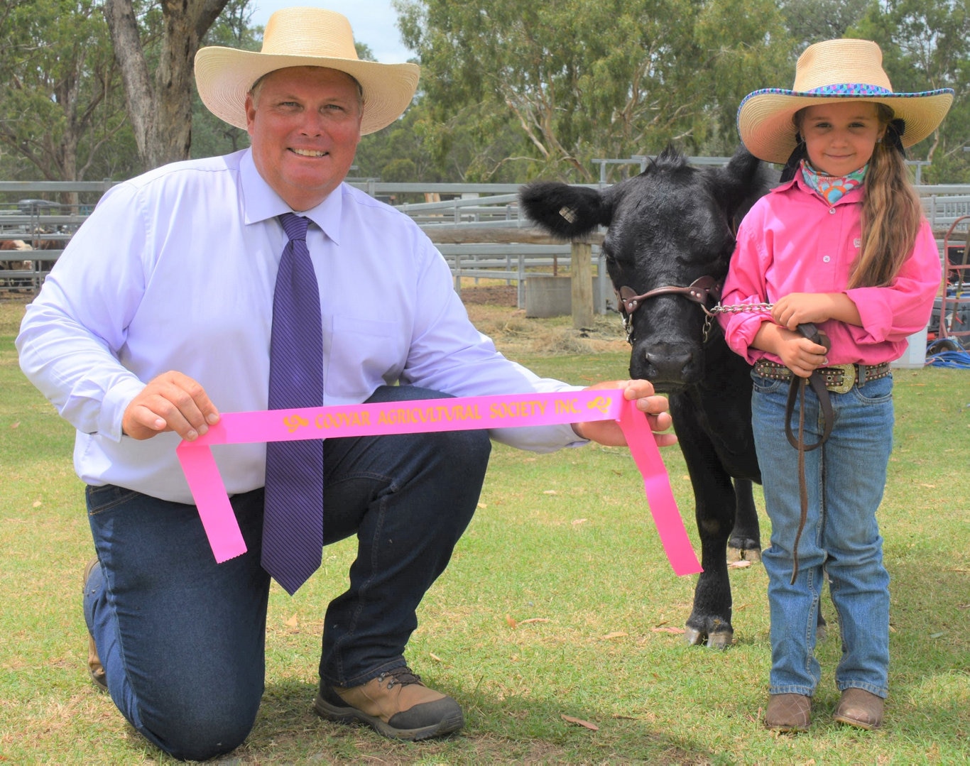Stud cattle judge, Jeff Rose and Erin Graham, 5, with her 18-month-old Lowline Angus heifer 