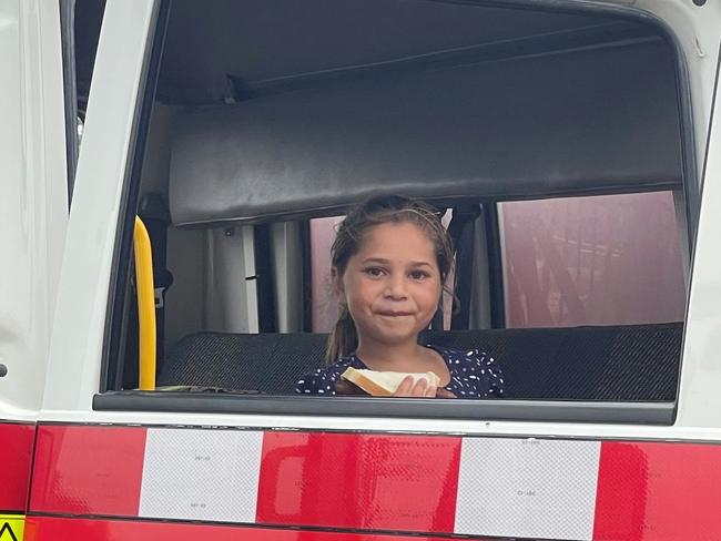 Girl in front seat of Walgett fire appliance. Photo: Fire and Rescue NSW