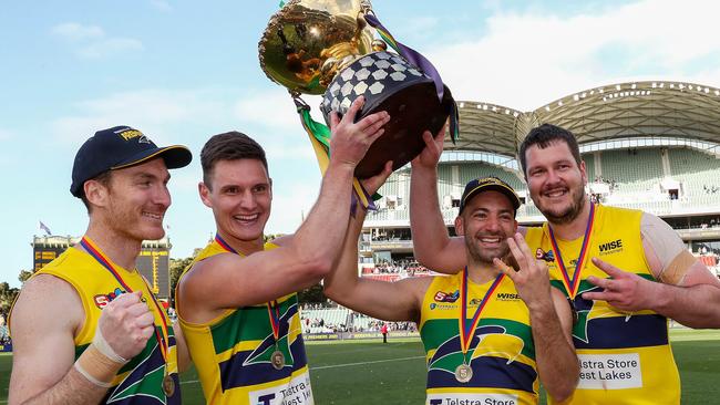 Patrick Giuffreda, Luke Thompson, Jimmy Toumpas and Jarrad Redden celebrate their third Eagles flag. Picture: Sarah Reed