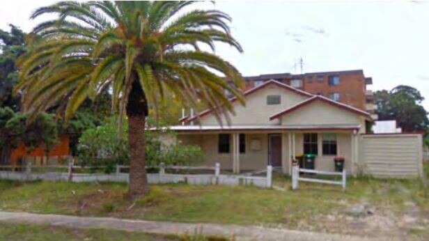 One of the older style homes which will be removed but the heritage listed Canary Island date palm at the front will remain.