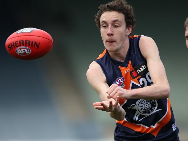 MELBOURNE, AUSTRALIA - SEPTEMBER 01: Campbell Edwardes of the Cannons handballs during the NAB League 1st Elimination Final match between the Calder Cannons and the Dandenong Stingrays at IKON Park on September 01, 2019 in Melbourne, Australia. (Photo by Mike Owen/AFL Photos via Getty Images)