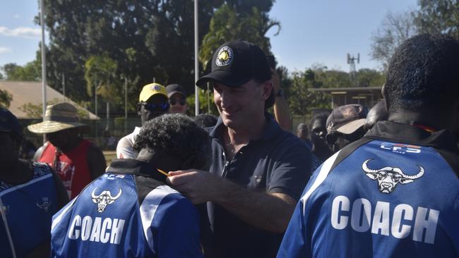 AFL incoming CEO Andrew Dillon presenting the medals to the Buffaloes following the win in the Tiwi Island Football League grand final between Tuyu Buffaloes and Pumarali Thunder. Picture: Max Hatzoglou