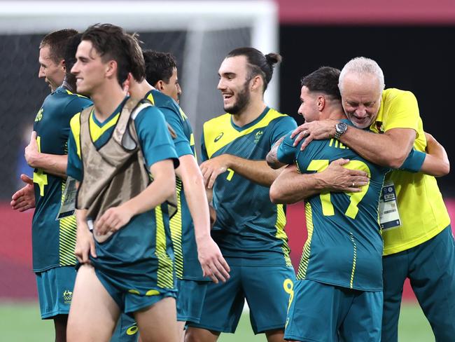 Graham Arnold joins in the celebrations after their opening Group G success. Picture: Getty Images