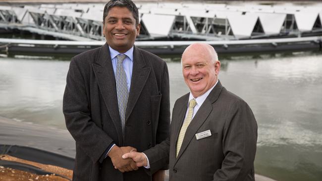 Former Northern Areas Council chief executive Colin Byles (right) with the head of a solar energy company, Raj Nellore, at a project in the Mid-North. Pictured: Supplied