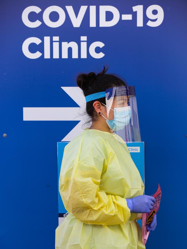 A nurse is seen with a COVID-19 test kit walking through the pop-up clinic at RPA. Picture: NCA NewsWire / Gaye Gerard