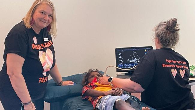 Deadly Hearts co-chair Vicki Wade with Royal Darwin Hospital's Dr Hilary Hardefeldt performing an echocardiogram at Yipirinya School as part of the Deadly Heart Trek 2024 Central Australia leg. Picture: Supplied