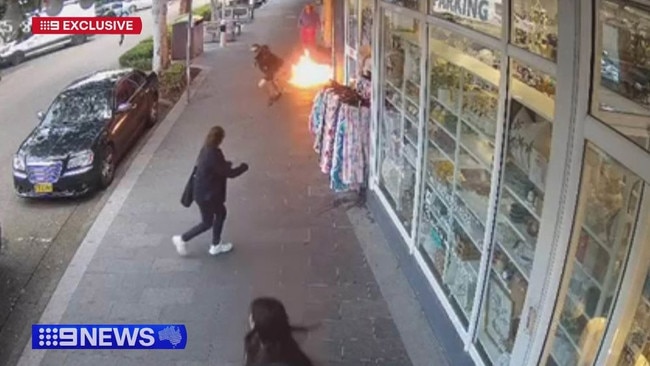 Adults and children were forced to jump over flames to escape a burning shop on the NSW Central Coast. Picture: Supplied / 9News