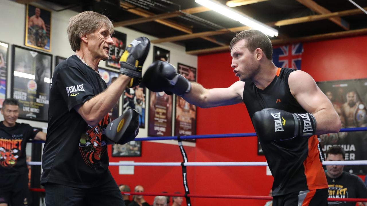 Australian boxer Jeff Horn and wife Joanne arrive to check in for their  flight at Brisbane airport, Wednesday, May 30, 2018. Horn will battle  American boxer Terence Crawford in a world welterweight