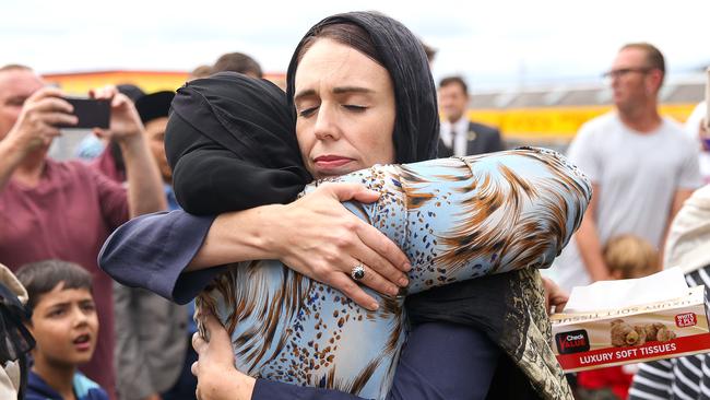 New Zealand Prime Minister Jacinda Ardern comforts a mosque-goer two days after the Christchurch massacre.