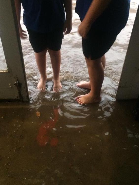 Water poured into shops along the main street of Yea after a downpour on Monday evening. Picture: Facebook/Belinda McGovern Dean