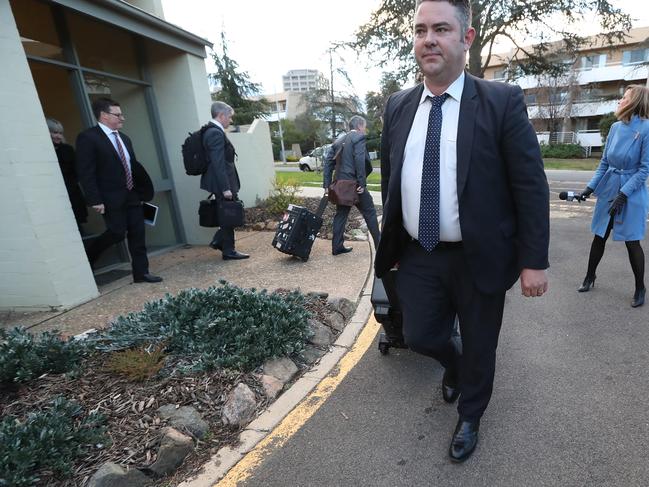 Federal police officers raiding the home of News Corp Australia journalist Annika Smethurst.