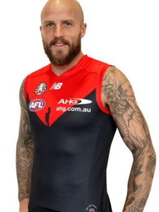 Nathan Jones models the Demons 2016 ANZAC Day jumper.