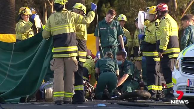 Paramedics fight to save the motorcyclist at North Adelaide. Picture: 7NEWS