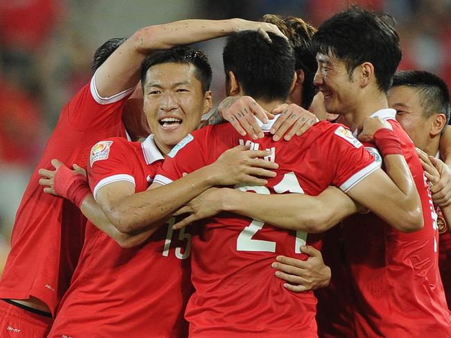 BRISBANE, AUSTRALIA - JANUARY 10: Yu Hai of China PR (#21) celebrates scoring a goal ith team mates during the 2015 Asian Cup match between Saudi Arabia and China PR at Suncorp Stadium on January 10, 2015 in Brisbane, Australia. (Photo by Matt Roberts/Getty Images)