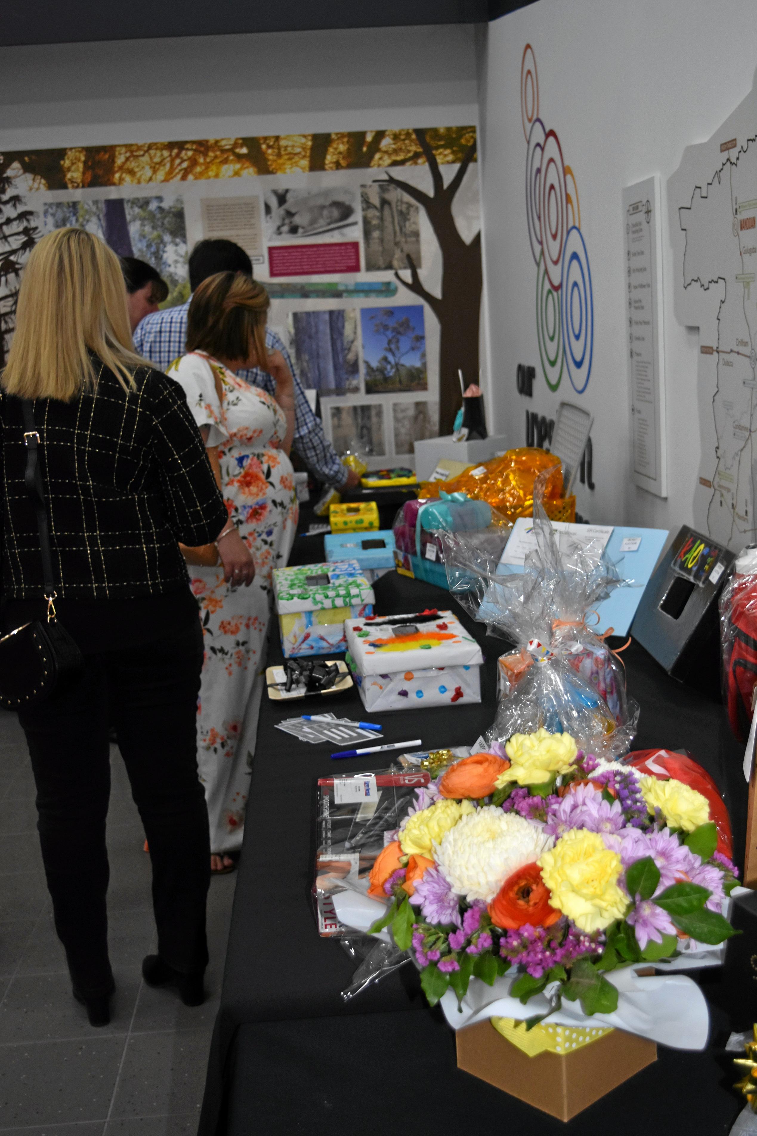 Guests placing bids in the silent auction at KAOS. Picture: Shannon Hardy