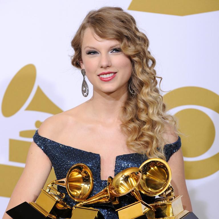 Backstage with her awards for Album of the Year, Best Female Country Vocal Performance, Best Country Song and Best Country Album at the Grammy Awards in 2010.