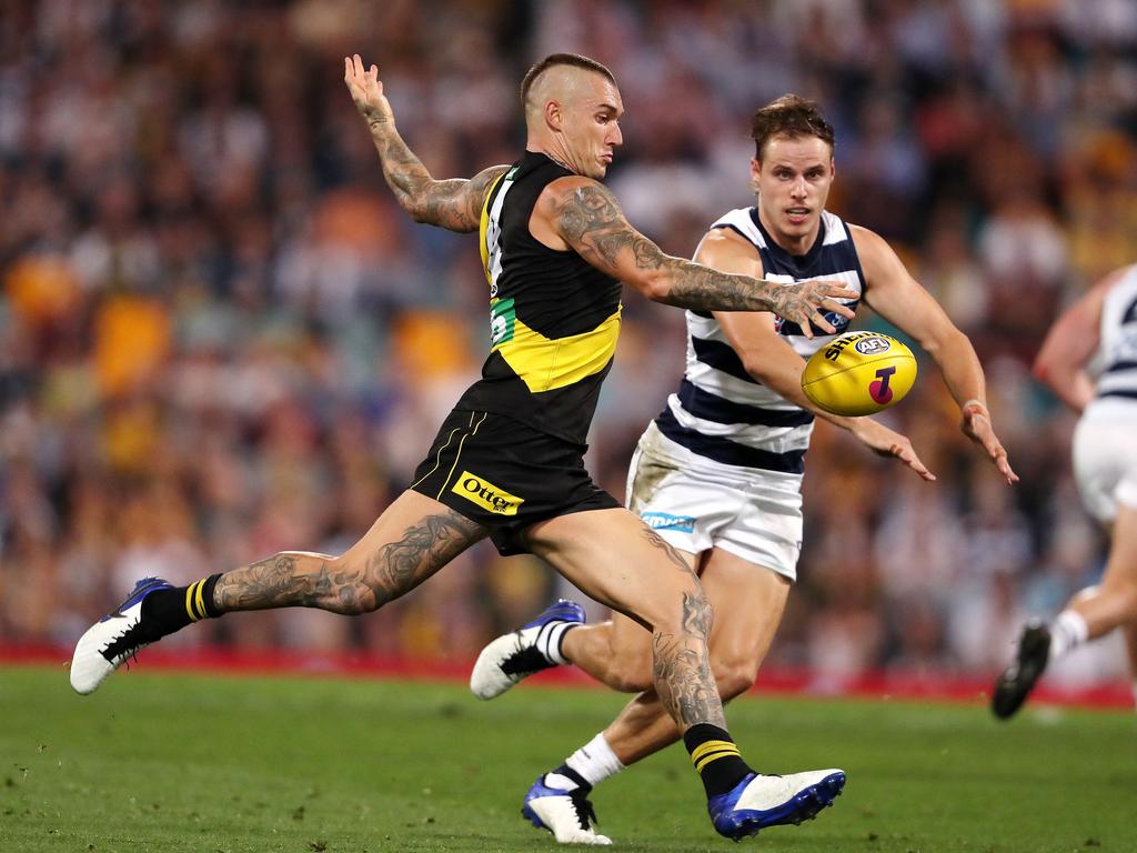 Dustin Martin gets the kick away under pressure from Jake Kolodjashnij. Picture: Sarah Reed