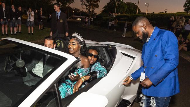 Irenne Kininga and Jacques Nikodemu Ntambwe arrive at Harristown State High School formal at Highfields Cultural Centre, Friday, November 18, 2022. Picture: Kevin Farmer