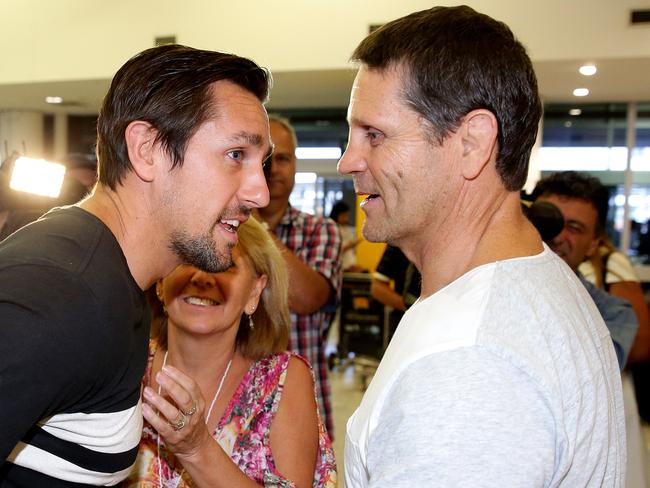 Sydney Roosters Mitchell Pearce greeted b his parents Terri and Wayne after arriveing at Sydney Airport after his stint in rehabilitation .Picture Gregg Porteous