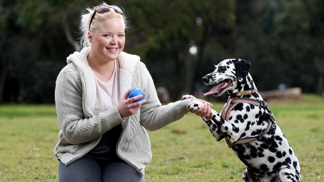 Responsible owner Leah Watts plays with her dog Delilah at the North Adelaide dog park. Picture: Calum Robertson