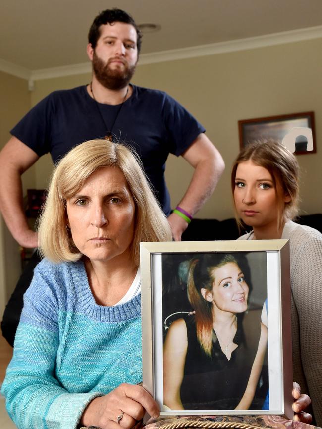 Mum Kerryn Robertson, daughter Indiana and son Jesse with a picture of Rekiah.