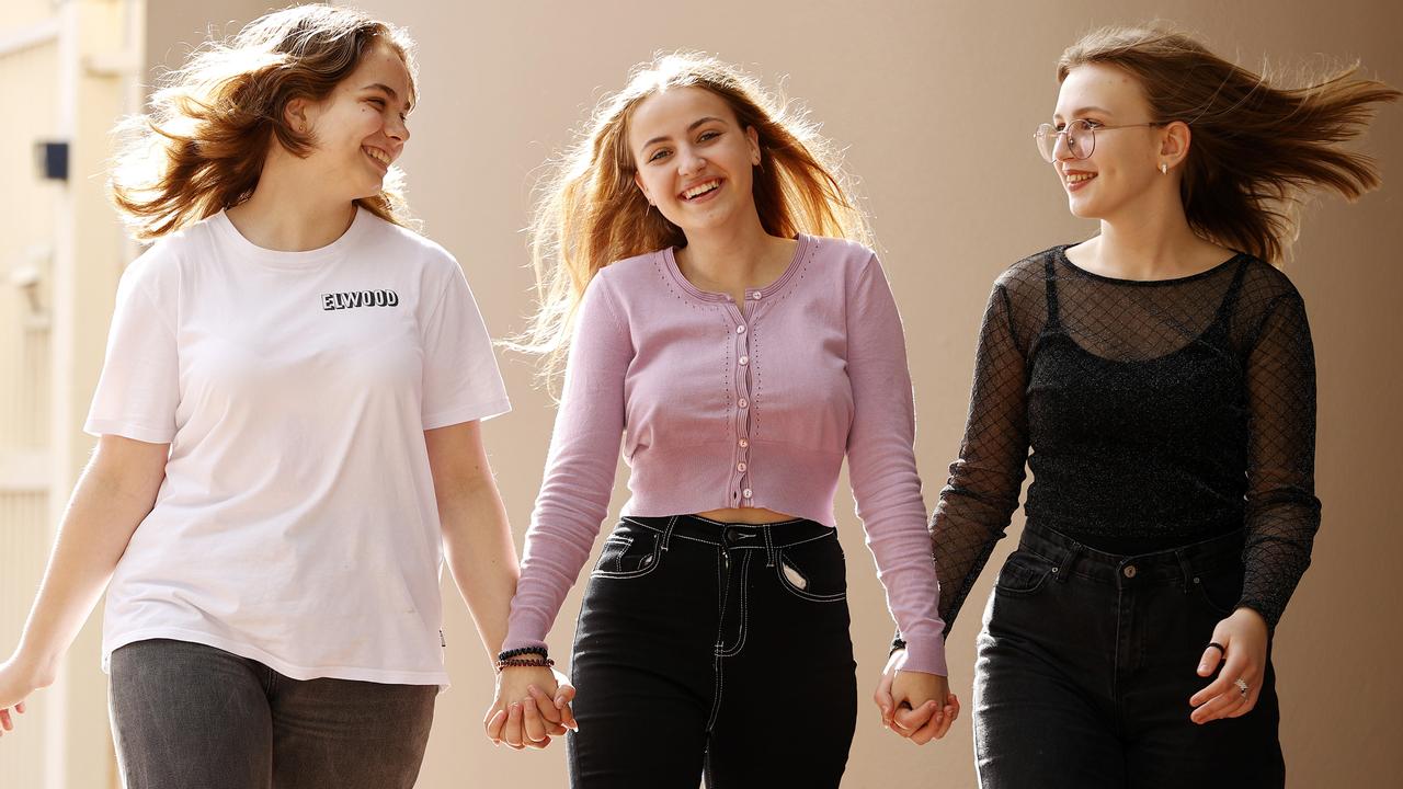 Ukrainian teens Sofia Shamanskaya, Anhelina Shevchuk, and Nika Kovalneko, all 14, are finding new friends and after arriving in Sydney as refugees fleeing war in their homeland. Picture: Tim Hunter
