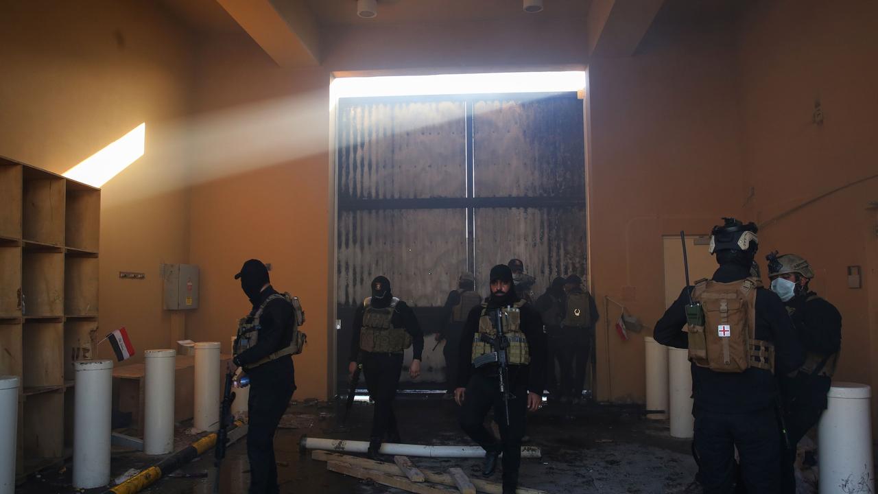 Iraqi security forces stand guard at the entrance of US Embassy in the capital Baghdad. Picture: Ahmad Al-Rubaye/AFP