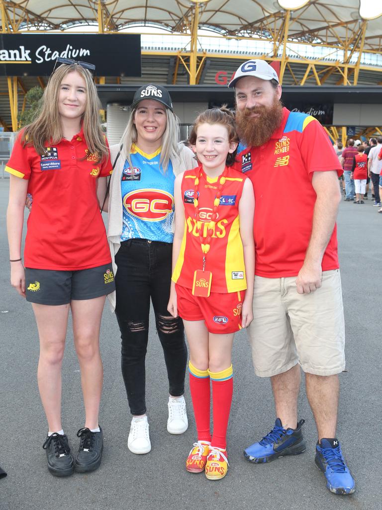 The Gold Coast Suns will host its first AFLW final when they take on the Sydney Swans on Saturday night. Tatiana, Trudy, Maddison and Matt Locke. 11 November 2023 Carrara Picture by Richard Gosling