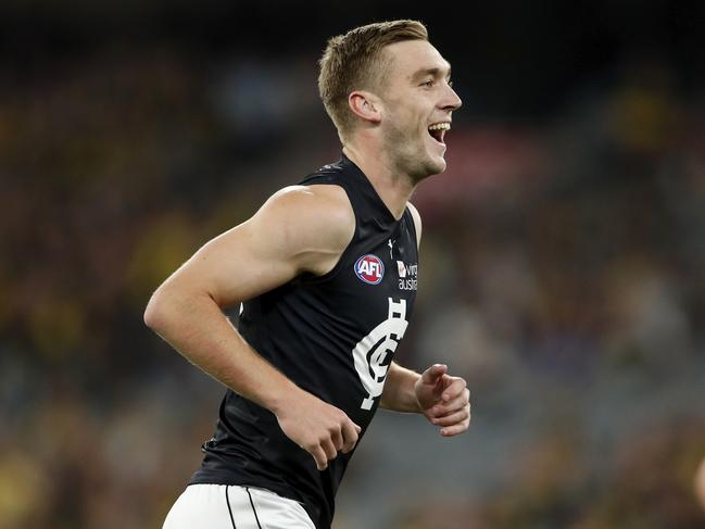 MELBOURNE, AUSTRALIA - MARCH 18: Oscar McDonald of the Blues celebrates a goal during the 2021 AFL Round 01 match between the Richmond Tigers and the Carlton Blues at the Melbourne Cricket Ground on March 18, 2021 in Melbourne, Australia. (Photo by Dylan Burns/AFL Photos via Getty Images)