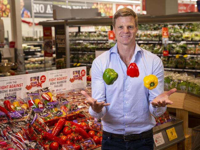 Nick Riewoldt with boxes of tomatoes and red capsicums for a Maddie's Vision initiative. Picture: Wayne Taylor