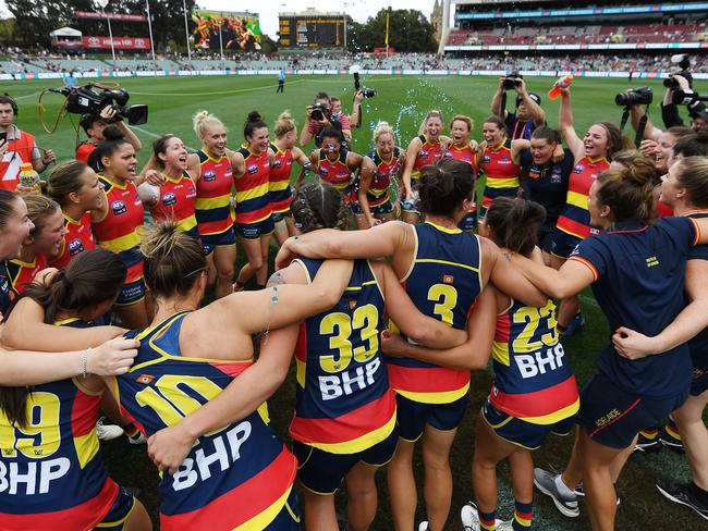 Crows players sing the club song after winning the AFLW Preliminary Final against Geelong by 66 points. Both those who had taken the field, and those not selected from the squad, sang together. Picture: Mark Brake/Getty Images